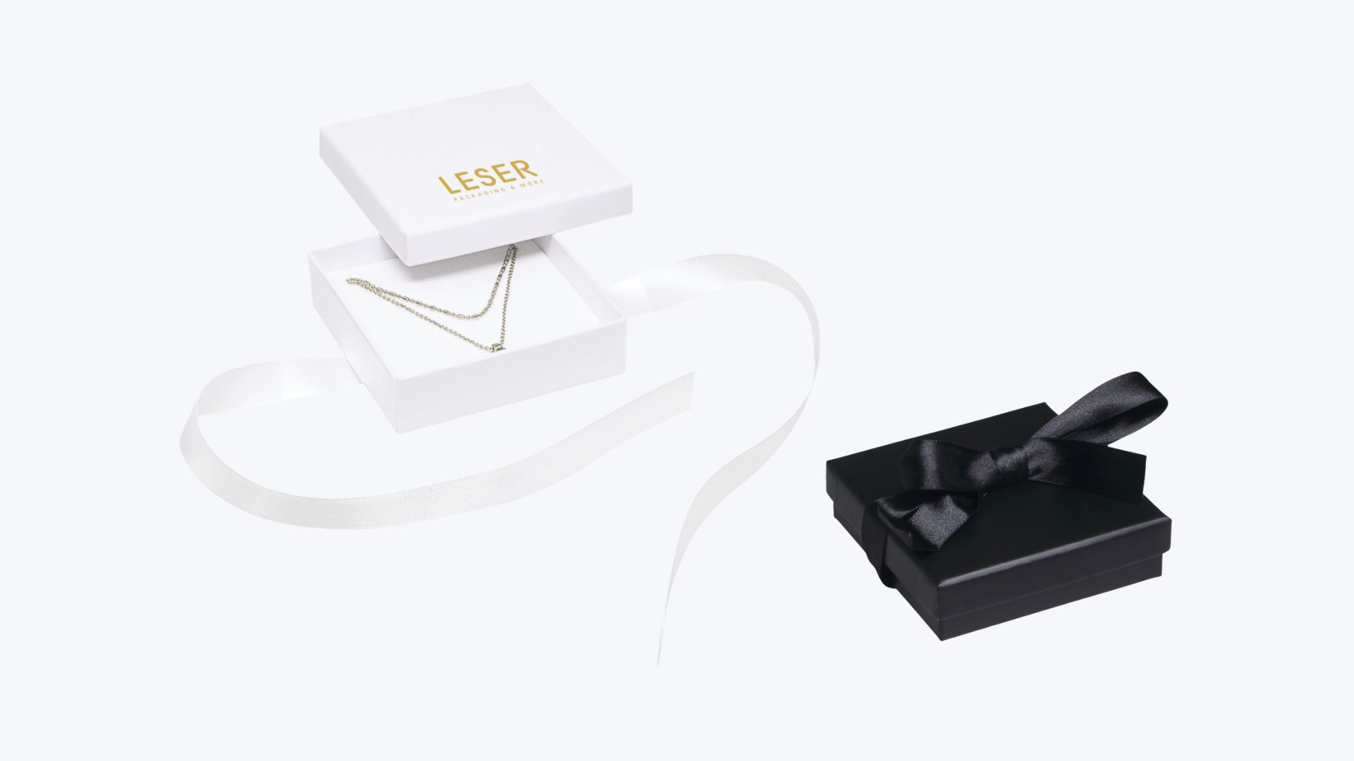 Serie 0276 LOOP.<br>Unsere Kartonschachteln mit Schleifband. Serie 0276 LOOP.<br>Unsere Kartonschachteln mit Schleifband.